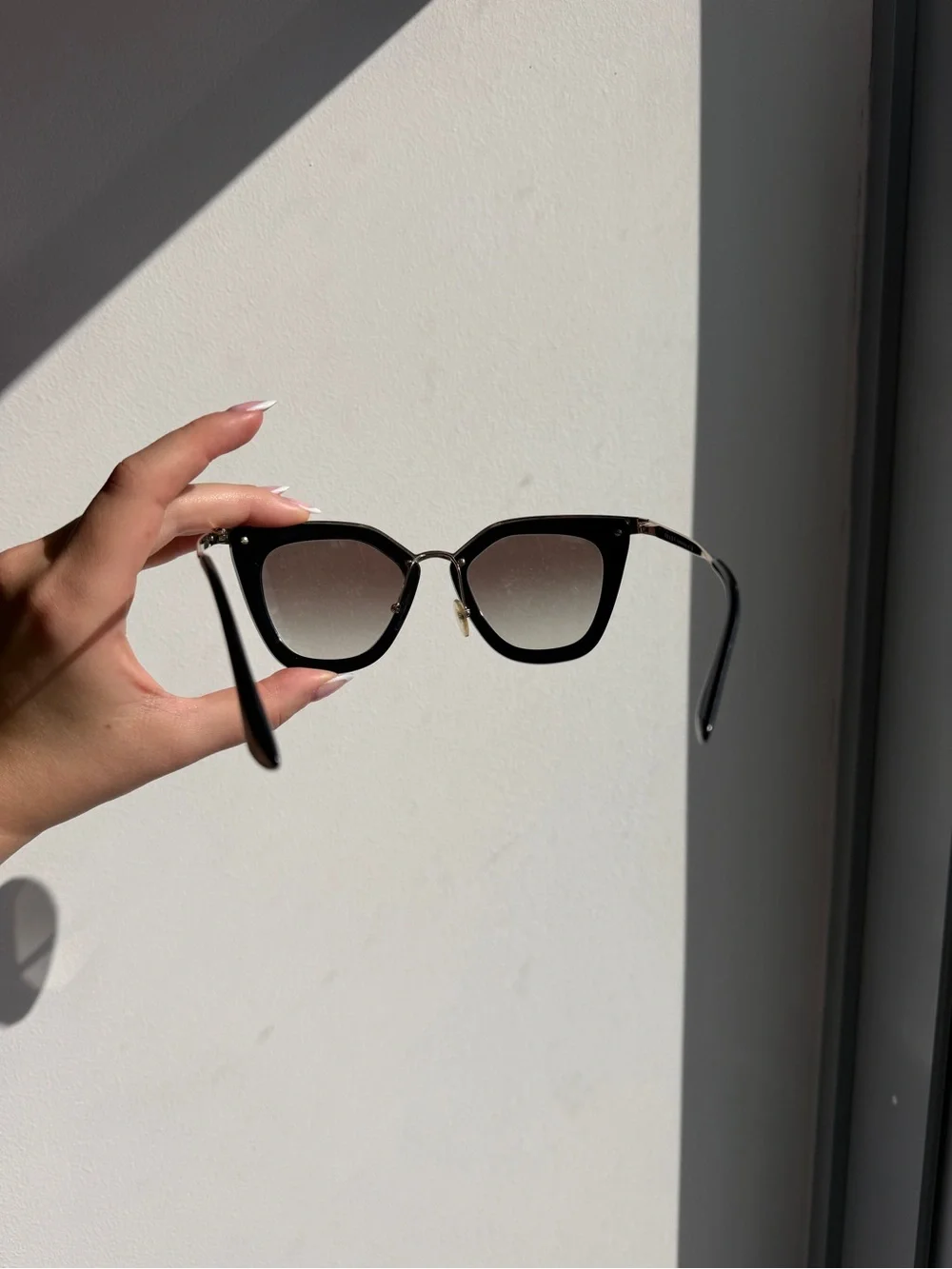 Prada Black Cat-Eye Sunglasses with Gradient Lenses